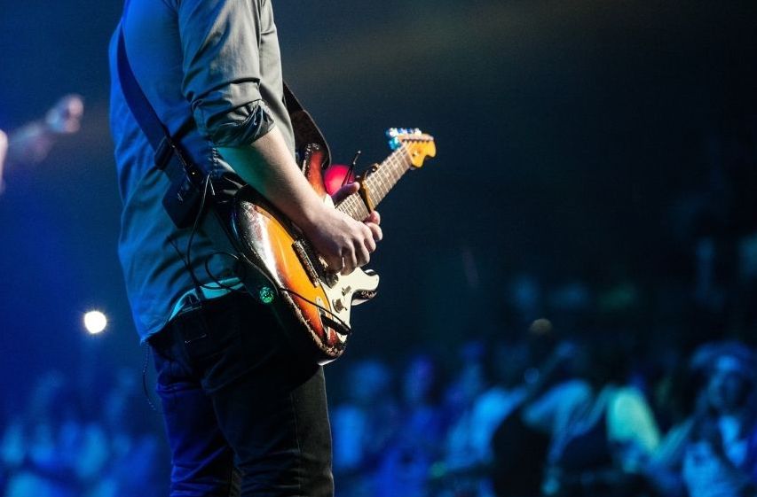 Front row at a music festival—custom VIP concert travel packages to global events.