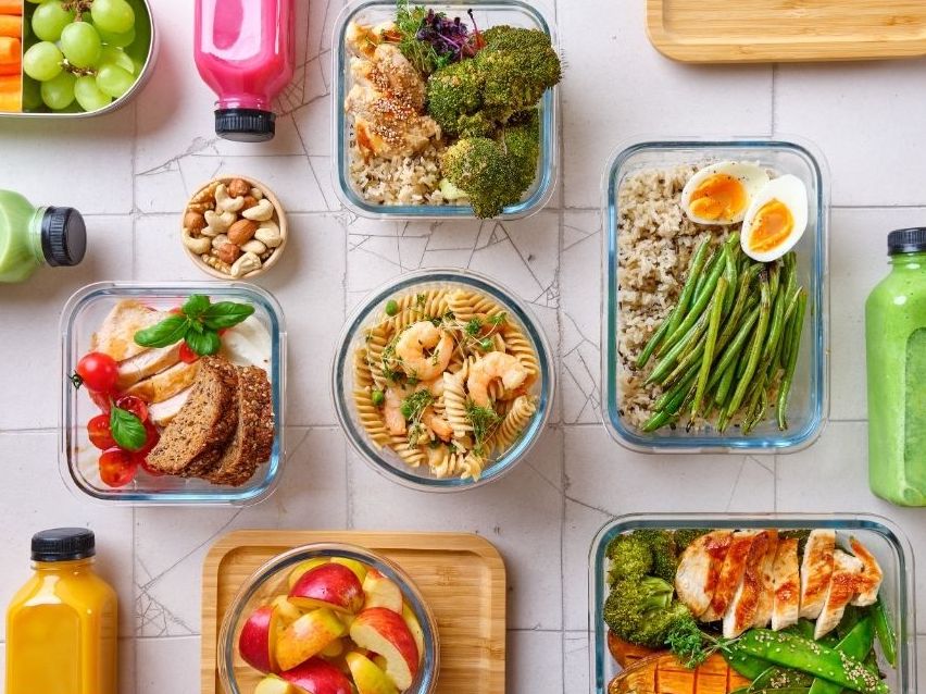 Colorful, nourishing meals prepped for a wellness retreat menu, featuring fresh vegetables, grains, and plant-based proteins.