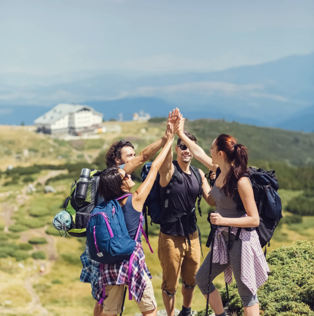Friends walking together on an easy countryside hiking trail in Europe