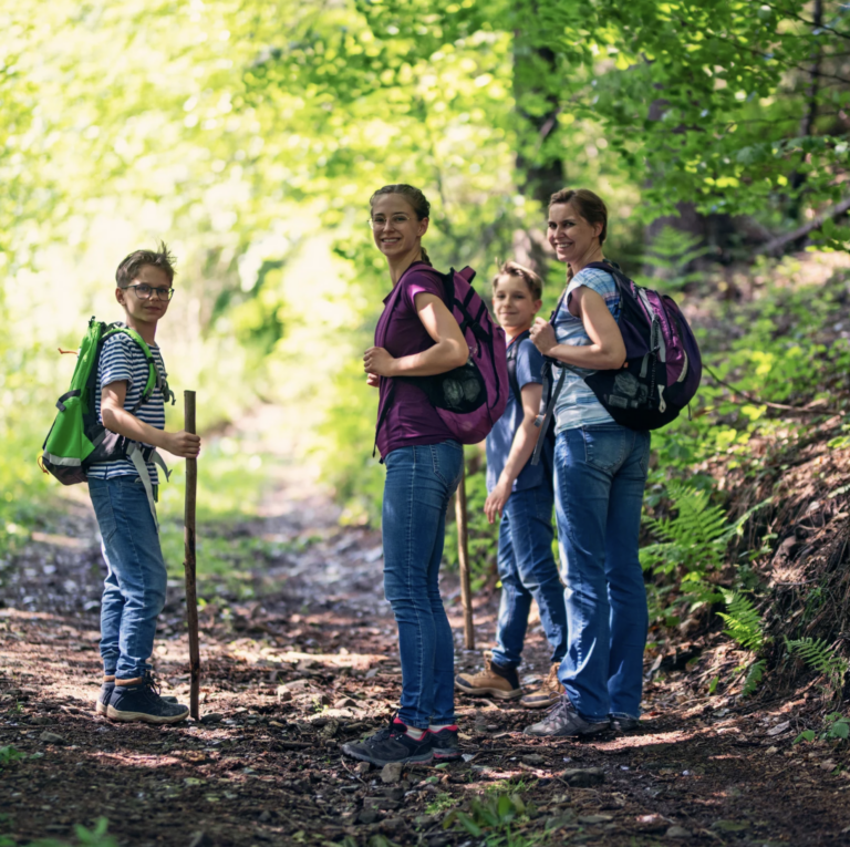 Active family with teenagers hiking during a luxury travel journey